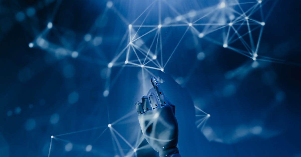 a robotic hand reaching into a digital network on a blue background symbolizing ai technology